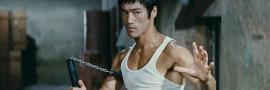 Bruce Lee is depicted in a fighting stance, showcasing his immense concentration, unrivaled skills, and the mystique surrounding his persona.